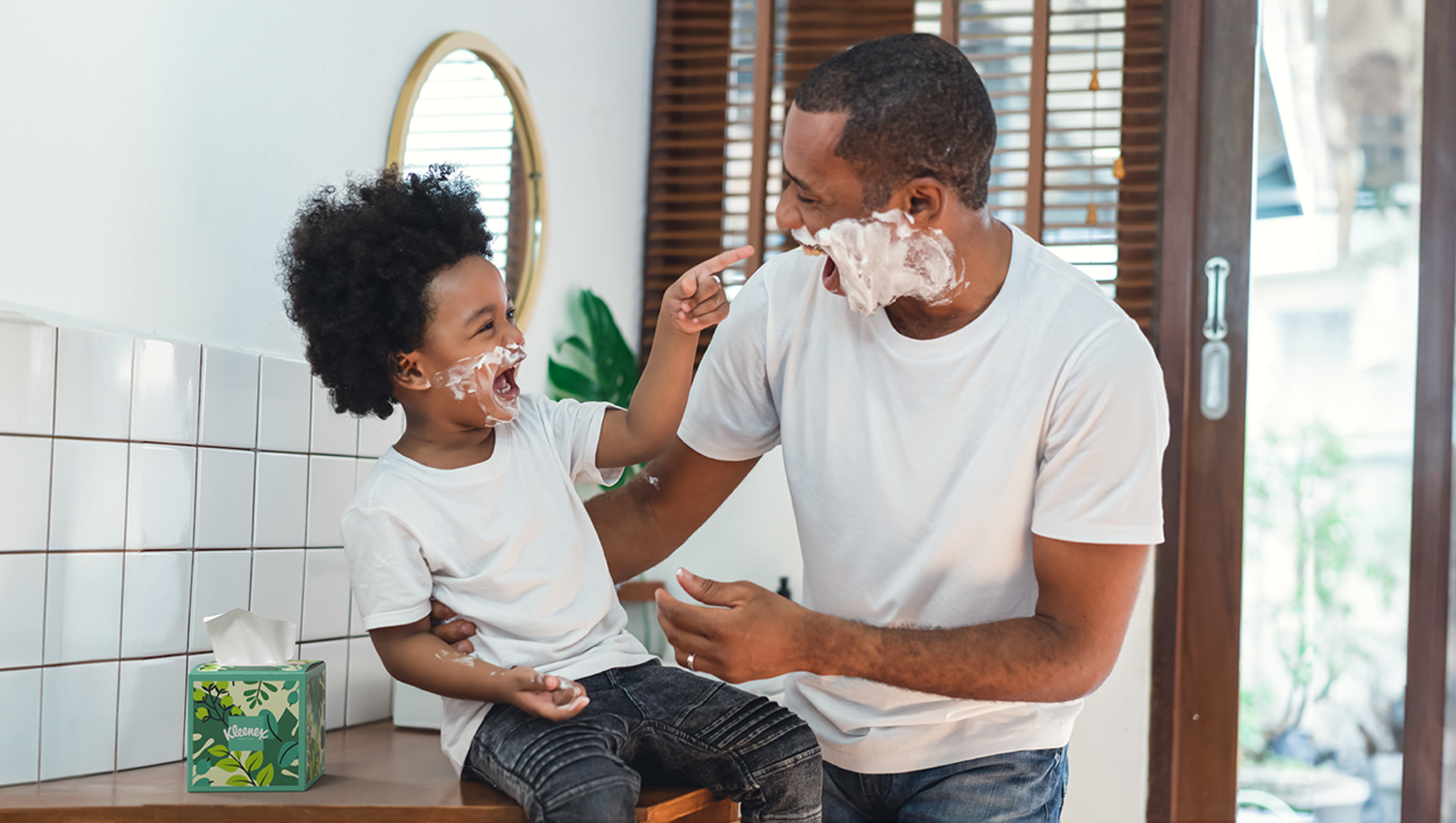 parent and young child shaving together